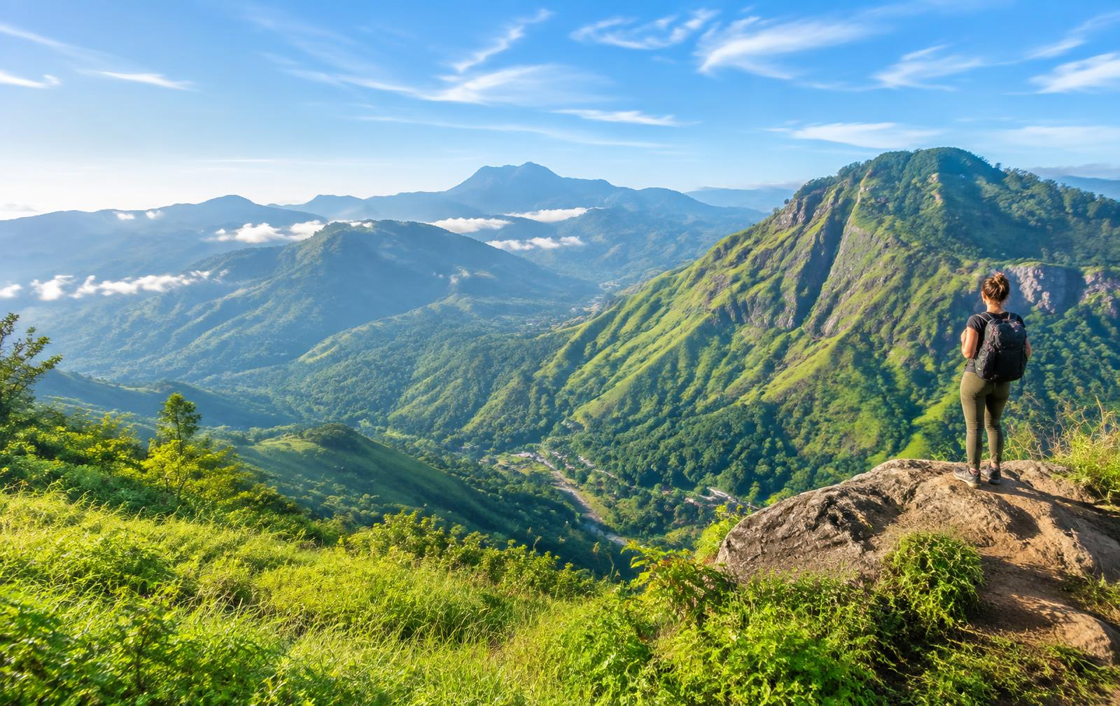A traveler overlooking the green mountain valleys of Ella, Sri Lanka